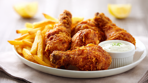 Fried chicken and fries served with garlic sauce dip.